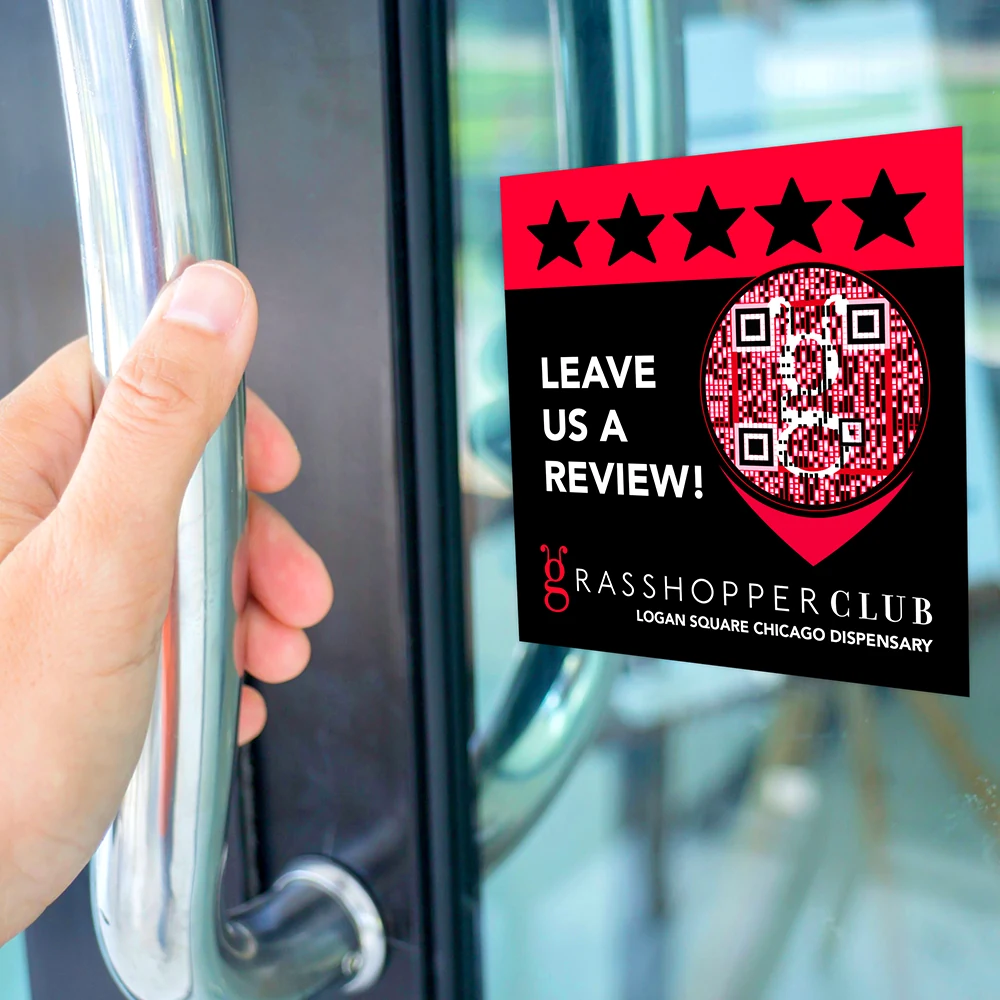 Grasshopper Club QR review window cling displayed at the store exit.